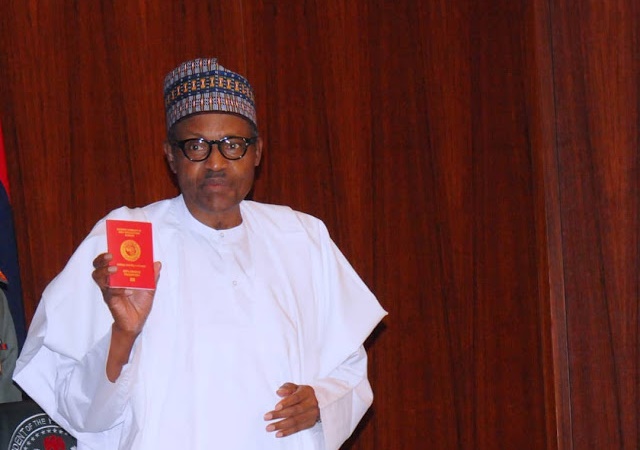 More Photos of president Buhari As He Receives New Nigerian Passport with 10-Year Validity + New Prices of Passport