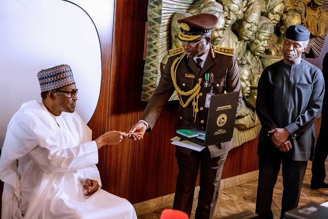 More Photos of president Buhari As He Receives New Nigerian Passport with 10-Year Validity + New Prices of Passport