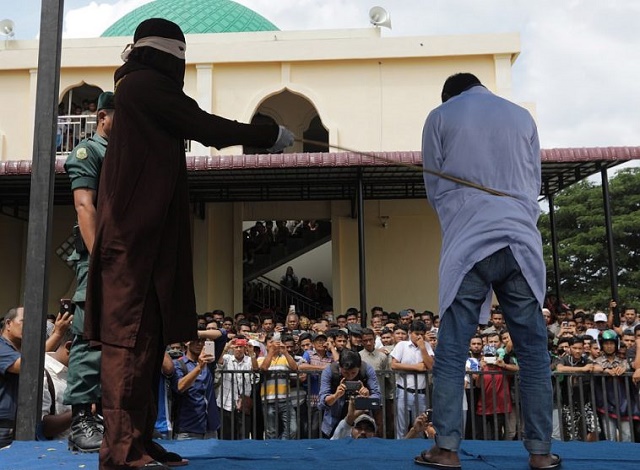 Teenagers Flogged Publicly For Hugging Each Other In Indonesia [Photos]