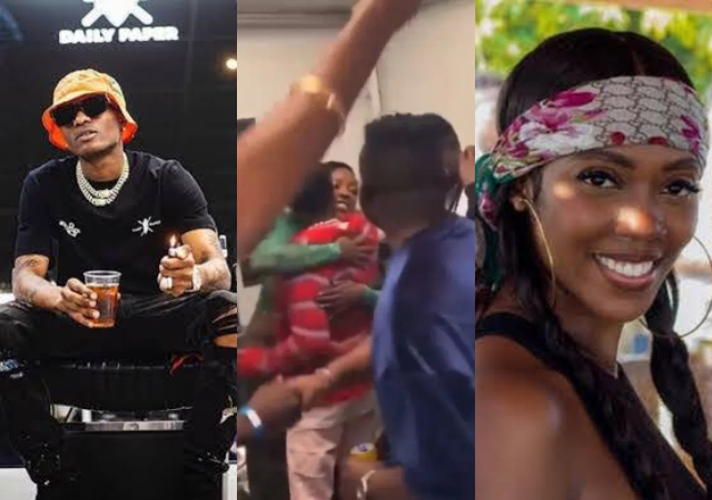 Wizkid and Tiwa Savage spotted hugging it out at a party in Germany [Video]