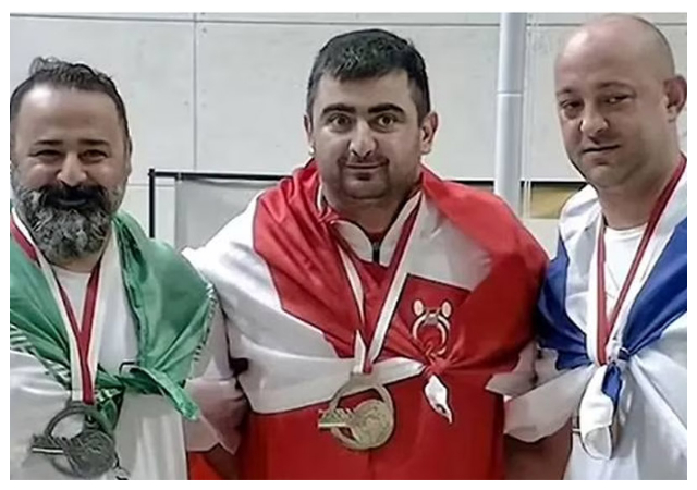 Iran slams Lifetime Ban to Weightlifter for Shaking Hands with Israeli Co-Competitor
