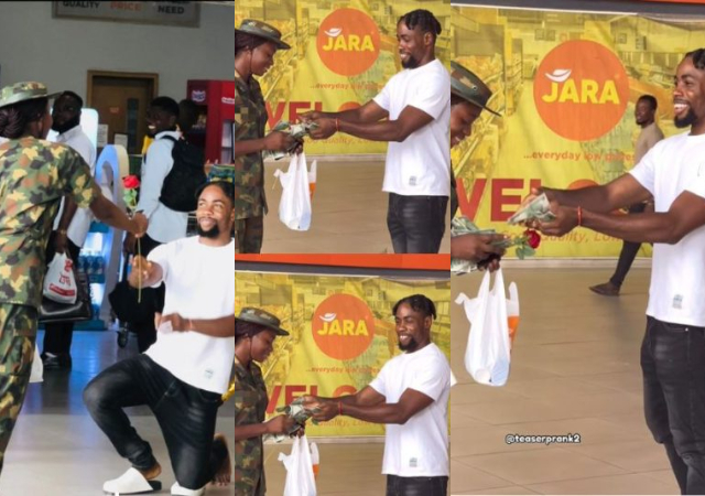 "If na police she go bend down pick am" – Reactions as man gifts a female soldier flower & money at the mall