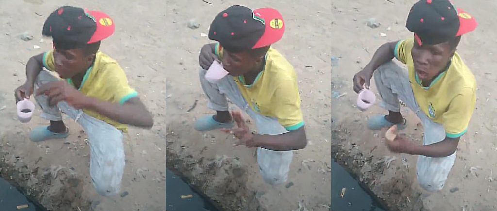 Man Drinks Dirty Drainage Water While Eating Bread
